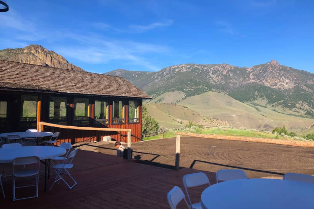 view of twin peaks guest ranch while glamping in idaho, mountains and a building in the foreground
