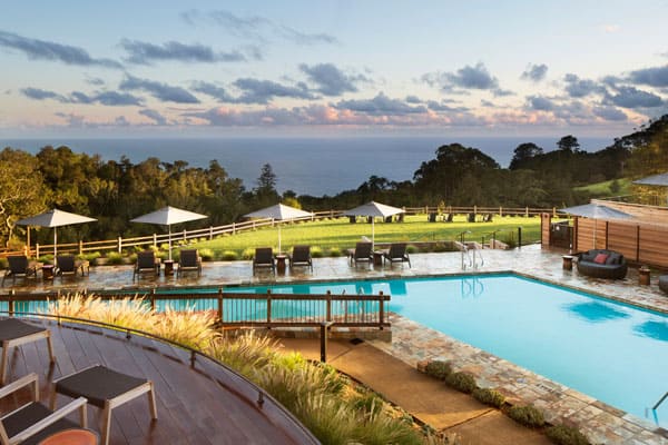 Ventana Big Sur Glamping Resort pool view with chairs and ocean in the background