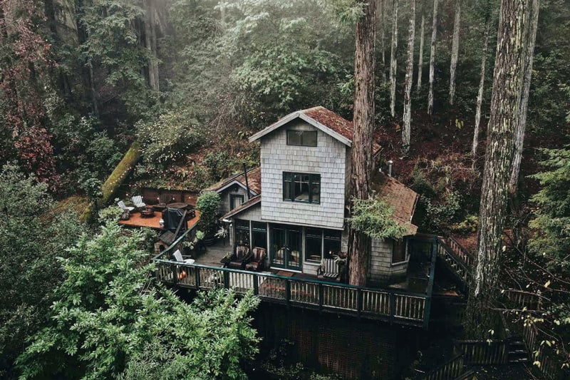 crows nest glamping treehouse bay area view from above with the 2 story treehouse with deck on hillside