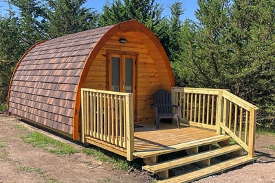 Kimberly Creek Retreat glamping pod Nebraska view of wooden pod and deck