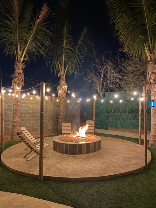 Relaxing by the light of the fire, twinkle lights and stars